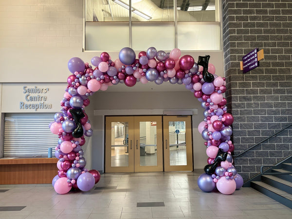 Balloon arc in a building lobby 