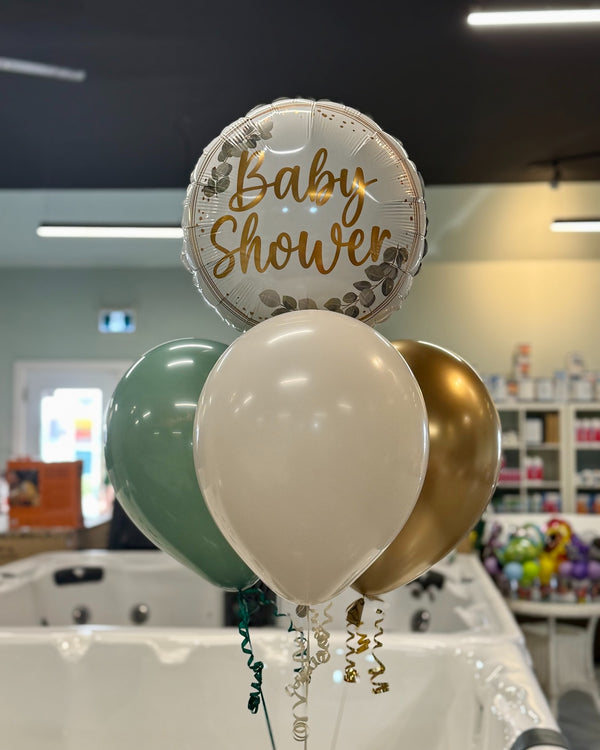 Decorative balloons with 'Baby Shower' text in a store setting