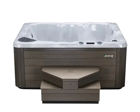 Hot tub with steps featuring the Hybrid brand.