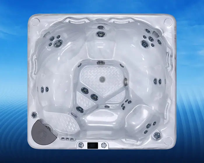top down view of a beachcomber 570 Anniversary Edition hot tub on a blue background