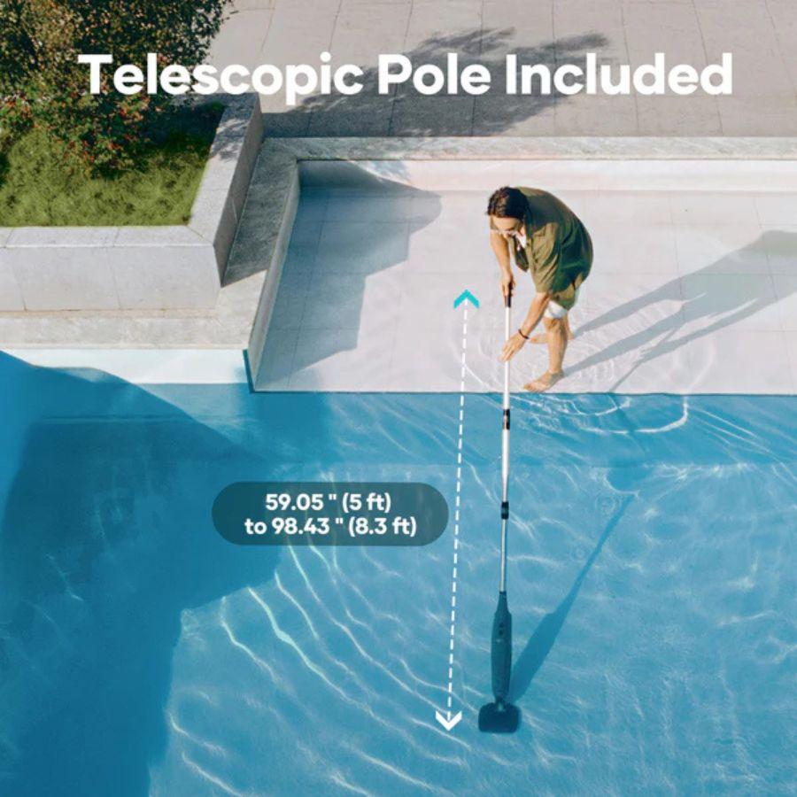 Person using a pool cleaning tool with a telescopic pole, pool and garden area in the background.