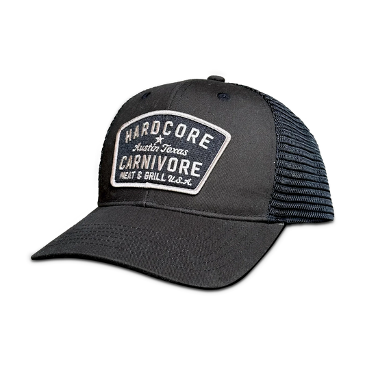 Black mesh cap with Hardcore Carnivore logo on a white background