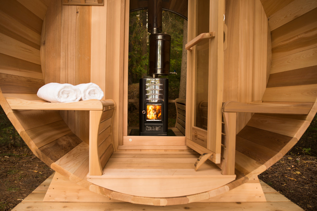 Cedar wood burning sauna interior with hot stones